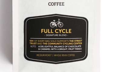 A bag of coffee that reads "full cycle signature blend. 50 cents of everybag sold supports The Street Trust and Community Cycling Center. Notes: a delightful balance of chocolate and caramel, with a bright 