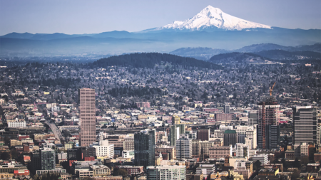 An aerial view of Portland Oregon with Mt. Hood in the distance.